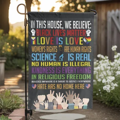 In This House We Believe Garden Flag, Promoting Equality, Love, Science, Kindness, And Justice For All In Bold Rainbow Colors Vertical Garden Flag