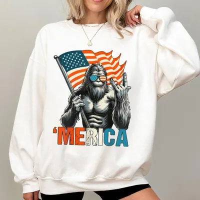 Bigfoot Merica Sweatshirt Funny Patriotic Sweatshirt Featuring Sasquatch Holding Flag Throwing A Hand Gesture Lighthear