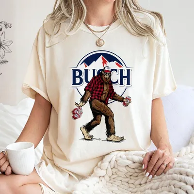 Busch Light Apple Sasquatch Hunting T-Shirt, Large Sasquatch In Plaid T-Shirt Carrying Busch Beer