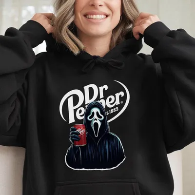 Scream & Sip Hoodie – Ghostface Holding Dr Pepper Can, Scary Movie Vibes Meet Soda Style, Halloween Graphic Hoodie, Unisex Streetwear