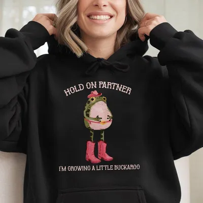 Hold On Partner I'M Growing A Little Buckaroo Hoodie, Funny Cowboy Baby Frog Hoodie, Cowgirl Pregnancy Top, Graphic Hoodie