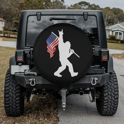 Bigfoot Flag Spare Tire Cover, Funny Sasquatch Design, Patriotic Forest Theme, Humorous Outdoor Adventure Style Gift For Nature And Cryptid Lovers Spare Tire Cover